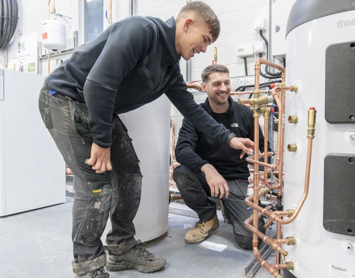 Student working on a plumbing installation board with copper pipes at Glasgow Kelvin College as part of the Green Academy training programme. Student working on a plumbing installation board with copper pipes at Glasgow Kelvin College as part of the Green Academy training programme.